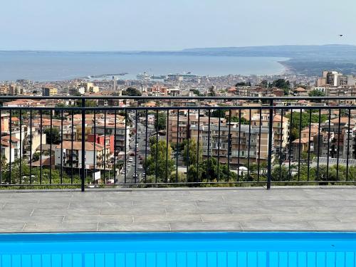 a view of a city from a balcony at Villa Leucatia in Sant’Agata Li Battiati 