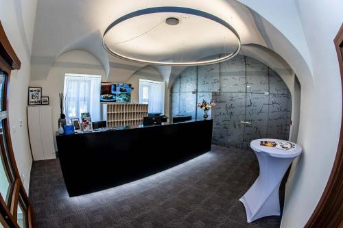 a salon with a black counter in a room at Zámek Třešť in Třešť