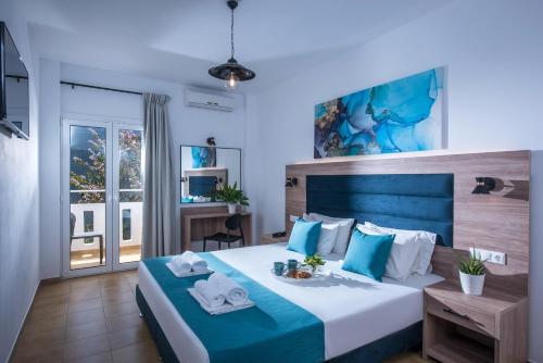 Postel nebo postele na pokoji v ubytování Floral Hotel