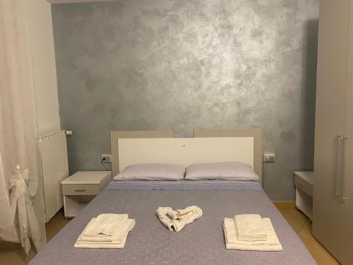 Postel nebo postele na pokoji v ubytování Appartamento Antico Teatro