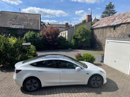 a white car parked in a driveway at Keller Höhe in Andernach