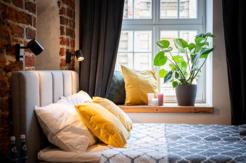 Katil atau katil-katil dalam bilik di Apartamenty Stare Cegły
