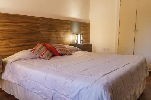 Una cama o camas en una habitación de Hotel Tafí