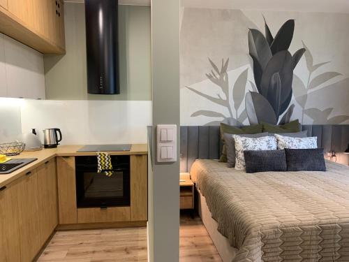 Posteľ alebo postele v izbe v ubytovaní Ukiel Park Green Apartament
