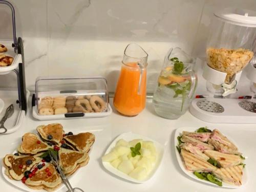 a table topped with plates of food and drinks at Casa di Taty B&B in Mestre