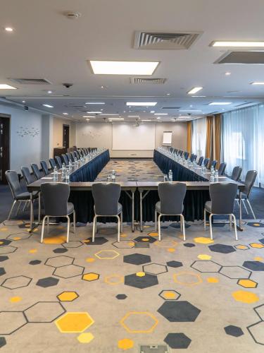 a large conference room with a large table and chairs at Park Inn by Radisson Hotel Astana in Astana