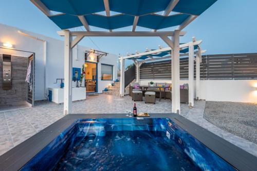 a pool in the backyard of a house at Santa Marina Milos in Mytakas