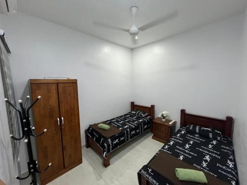 Postel nebo postele na pokoji v ubytování FADI BEACH GUESTHOUSE