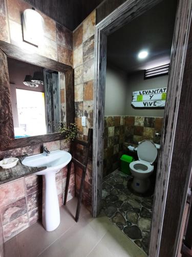 a bathroom with a sink and a toilet at Hotel Recreacional Marcelandia Santa Rosa de Cabal in Santa Rosa de Cabal