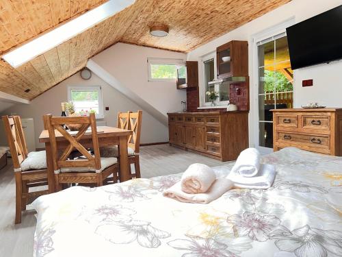 a child laying on a bed in a bedroom at PENSION POD SKALOU in Hřensko