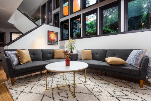 a living room with a couch and a table at Outdoor Entertaining Space Sedona Mtn-View Home in Sedona