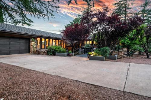 a house with a driveway and a garage at Outdoor Entertaining Space Sedona Mtn-View Home in Sedona
