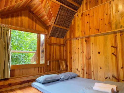 Кровать или кровати в номере Đà Lạt Củi Homestay