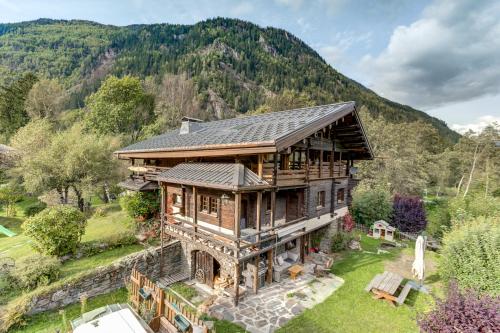 an overhead view of a house with a mountain in the background at Chalet Heron in Les Houches