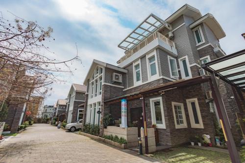 a house on a brick street with at Hualien Feel at Home BnB in Hualien City