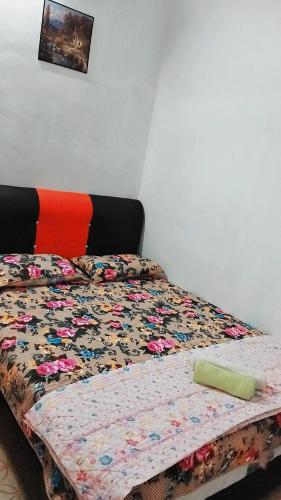Кровать или кровати в номере Homestay Cikgu Mas