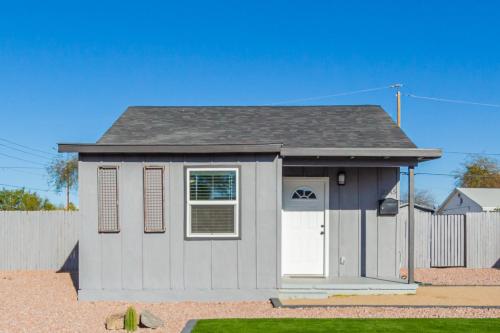 a small grey house with a white door at Dayton Coronado Historic District Phoenix home in Phoenix