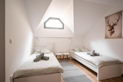 Ліжко або ліжка в номері Apartment MOUNTAIN PEARL Golte