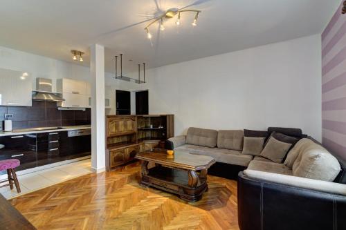 a living room with a couch and a table at Apartments Zora in Senj