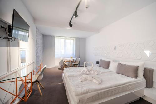 Ένα ή περισσότερα κρεβάτια σε δωμάτιο στο Niro Residence