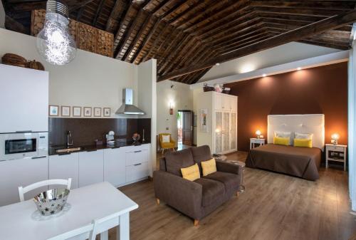 a living room with a couch and a bed at Casa Emblemática Salgado in Santa Cruz de la Palma