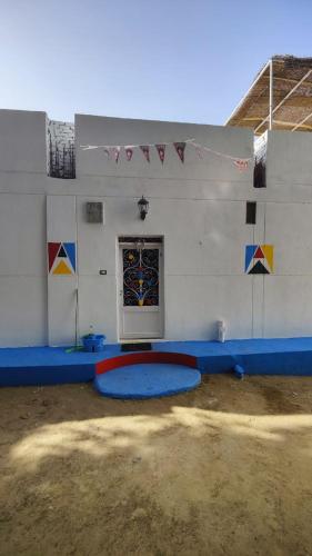 a room with a room with a wall with a window at ABAZIDO Nubian Guest House in Aswan