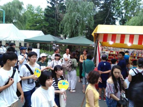 a group of people standing in a crowd at a market at DOWNTOWN　TOKO11 in Asahikawa