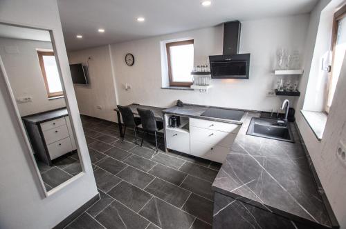 a kitchen with a sink and a counter top at Old Mill House in Bohinj