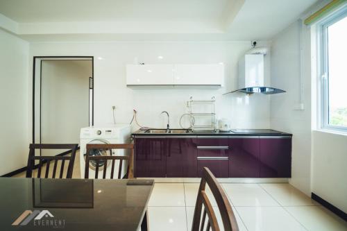 a kitchen with a sink and a counter top at Serene Heights by Evernent in Miri