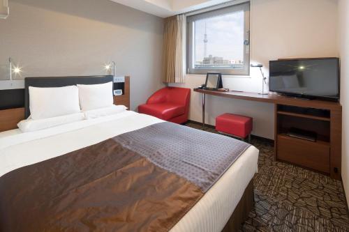 Ένα ή περισσότερα κρεβάτια σε δωμάτιο στο HOTEL MYSTAYS Asakusabashi
