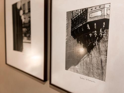 two framed pictures of a bridge on a wall at Hotel Doña Blanca in Jerez de la Frontera