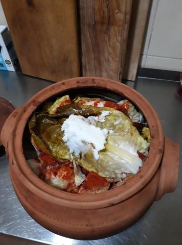 a bowl of food sitting on top of a table at Etno selo Lelić in Valjevo
