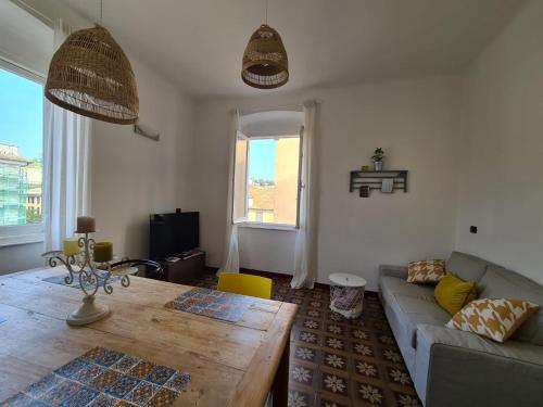 a living room with a couch and a table at Casetta in Centro, a Chiavari, by Cinqueterrecoast in Chiavari