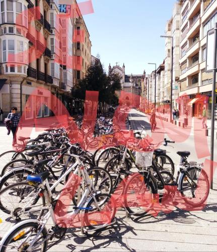 a bunch of bikes parked on a street at Begutxi LVI00061 in Vitoria-Gasteiz
