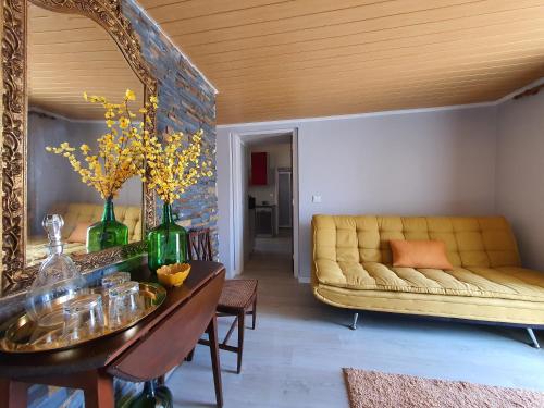 a living room with a couch and a table at Julia Old Village by Lisbon Village Apartments in Terrugem