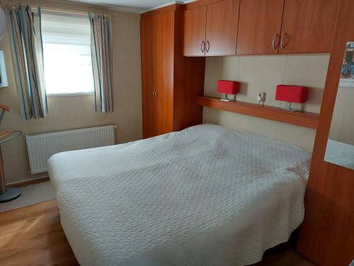 Postel nebo postele na pokoji v ubytování Schelde vakantie chalet