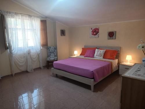 Postel nebo postele na pokoji v ubytování Casa AuroraRosa