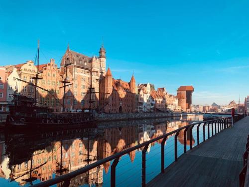 a view of a city with a river and buildings at MB Boutique Apartment Gdansk in Gdańsk