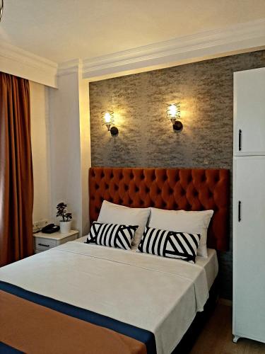 A bed or beds in a room at Hotel Nova