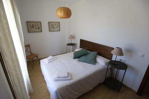Кровать или кровати в номере La Cancela Apartamentos Turísticos