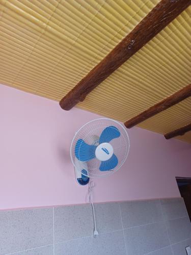 a fan in a corner of a room with a ceiling at Dar rachid ouzoud in Azilal