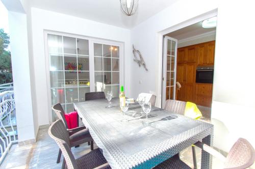 a dining room with a table and chairs at Casa Playa by Sonne Villas in Ferreries