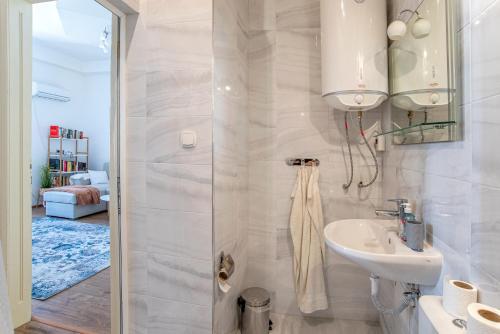 a bathroom with a sink and a shower at Supreme Luxury Top Central 1 Bedroom Apartment in Sofia