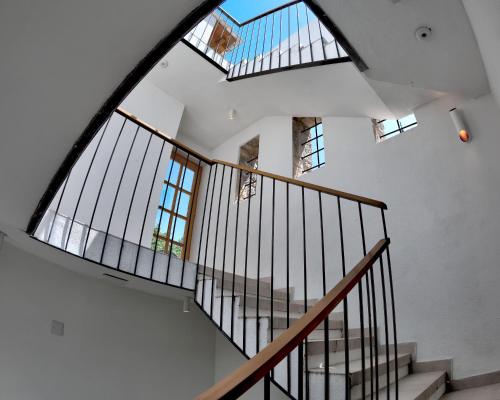 an image of a staircase in a house with windows at Villa Gunga in Mostar