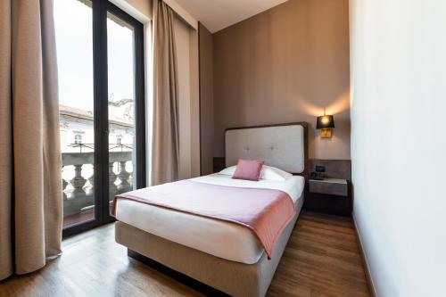Letto o letti in una camera di Mokinba Hotels King