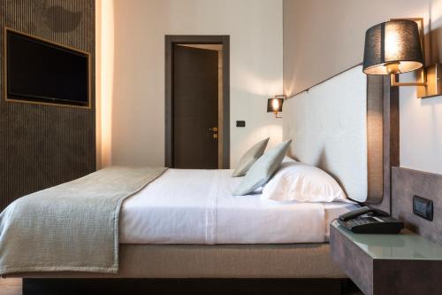 Letto o letti in una camera di Mokinba Hotels King