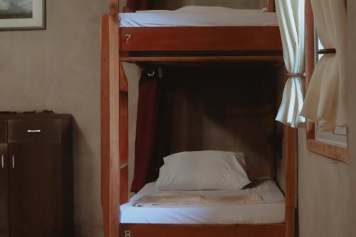 a couple of bunk beds in a room at Fable Hostel in Siquijor