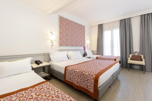 Ένα ή περισσότερα κρεβάτια σε δωμάτιο στο Hotel Della Conciliazione