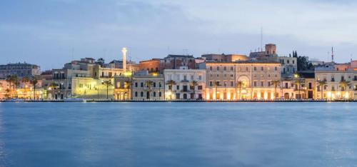 a group of buildings on the shore of a body of water at LATA LUXURY HOME CASA VACANZE in Brindisi