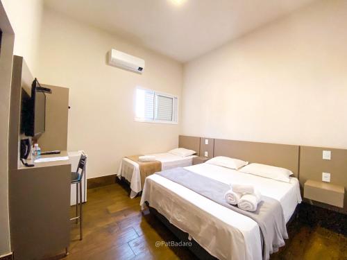 Postel nebo postele na pokoji v ubytování Pousada Reserva Central